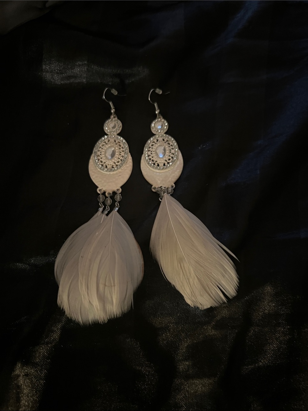 Elegant White Feather Drop Earrings with Silver-Tone Medallions